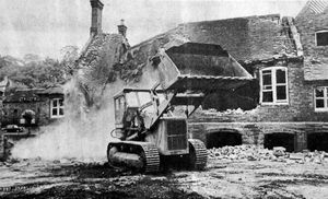 The demolition of St Mary's School, Bridgnorth, June 1970. The caption reads: 'The end of an era! This week saw the start of demolition work at the old St Mary's School premises in Low Town nearly four years after the school was closed for safety reasons. The building dates back to 1847 when it was erected as a memorial to Thomas Whitmore of Apley. Now the school site is to be the subject of a crucial public inquiry next week. Local authorities want the land for a car park - businessmen want it for a supermarket.'
