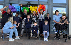 Staff and pupils at The Bridge School celebrating their Ofsted ratings.