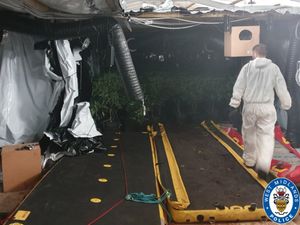 Officers from West Midlands Police check the area during the raid. Photo: West Midlands Police