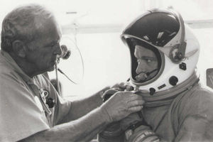 A NASA technician fits me into an Apollo space suit. It was an option but too expensive