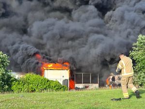 Supporting image for story: Large fire and explosions at lorry dealership as tyres and vehicles catch fire