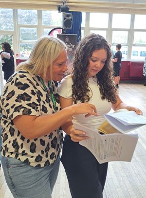 Mrs Dodd and Lille-Mae Jones reading Lillie-Mae's results