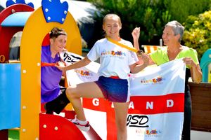 Billy shows off his gold medal with nursery manager Nicola Pugh and Pauline Chivers from the Tick Tock Day Nursery