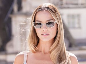 Supporting image for story: Margot Robbie dazzles in pink outfit for Big Bold Beautiful Journey photocall