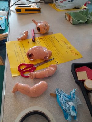Broken. The doll before the repair cafe experts got to work