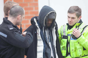 Police arrest a man near to the scene in Harborne Road, Birmingham matching the description of the main suspect. Image: Newsteam