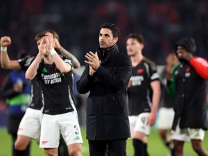 Mikel Arteta and his players applaud the Arsenal fans after their win over PSV Eindhoven