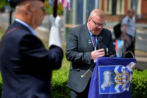 Councillor Damian Corfield speaks at the memorial event