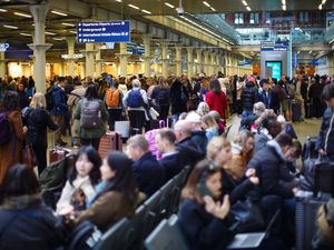 Passengers waiting at St Pancras station