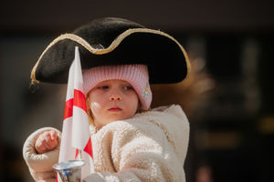 A young resident looks on as St George defeats the dragon