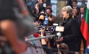 Theresa May arrives in Brussels for a meeting with EU leaders following her Commons defeat