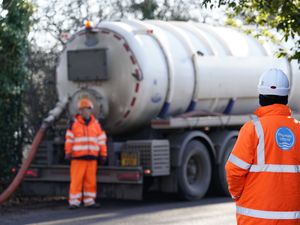 Thames Water workers next to a tanker