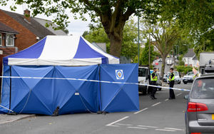 Police at the scene in the days that followed the fatal shooting in Well Lane