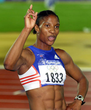 Denise Lewis celebrates winning the Gold medal in the Women's Heptathlon at the Olympic Games in Sydney, Australia