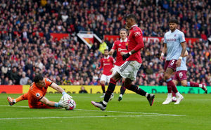 Manchester United's Marcus Rashford has an attempt on goal which is stopped by Aston Villa goalkeeper Emiliano Martinez