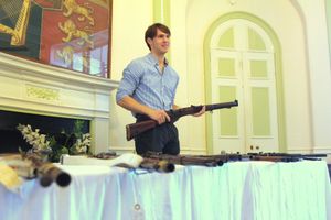 Weapons demonstrator Ben, holding a Lee-Enfield rifle.  