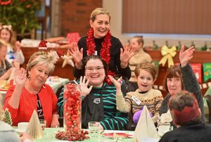 Kelly Sheridan (middle) is pictured with volunteer and her mother-in-law Paul (above) and surrounded by people who enjoyed the free Christmas event at Holy Trinity Church.
They include Judy Oakley, Hunter aged five and Maureen Darby.

Holy Trinity Church Hall in Wordsley and a special Christmas part was being put on for free, complete with a meal, singer and presents.   In the middle standing is helper: Paula Sheridan, and infront of her is her daughter in law and event organiser: Kelly Gordon. With her is: Judy Oakley, Hunter 5, Maureen Darby.