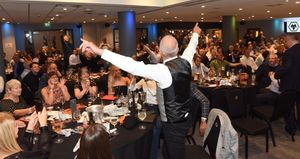 Bully leads the singing on the night dedicated to him at Molineux’s packed-out Hayward Suite