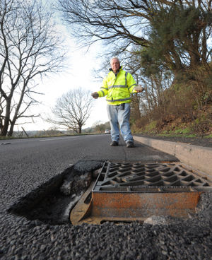 Unhappy with the 'dangerous' condition of the road on the A442, at Quatford is Ray Hulse, of Bridgnorth