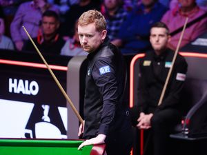 Ben Woollaston (left) during his match with Mark Selby (right) at the World Snooker Championship