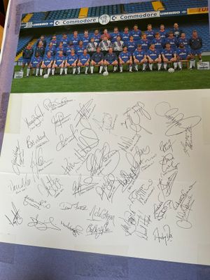 A Chelsea team picture accompanied by squad signatures