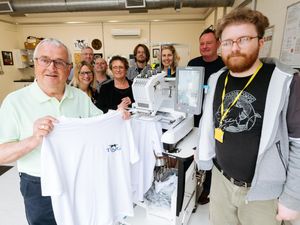 Supporting image for story: Former Goodyear workers donate embroidery machine to blind charity