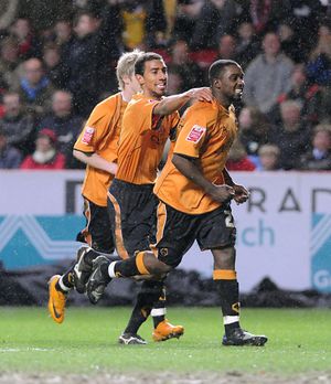 Sylvan Ebanks- Blake celebrates his second goal with fellow scorer Karl Henry.