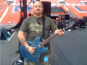 Alex “Big Al” Harris playing Dave Grohl’s (Foo Fighters) Guitar at Wembley Stadium. Photo: Big Al's