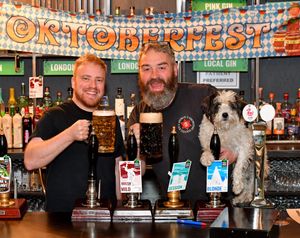 Alex Hill, Shane Swindells and Jack the dog look forward to Oktoberfest celebrations at Green Duck Beer Co.