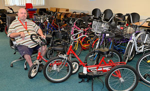 David Pryce with some of the trikes he has collected