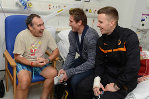 From left is patient Alex Sinuks, Tomasz Kuszczak, and Lee Evans
