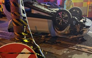 Overturned white car.