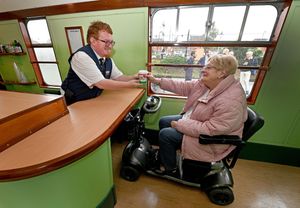 DUDLEY COPYRIGHT NATIONAL WORLD TIM THURSFIELD -18/09/25The official unveiling of the accessible disability carriage at Severn Valley Railway, Kidderminster.Elaine is served a cuppa at the low level counter.