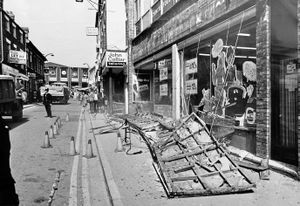 May 7, 1975, the story began: 'A Whittington mother out shopping was snatched to safety seconds before half a ton of wood and masonry crashed from the front of an Oswestry supermarket. It missed her by inches.' The supermarket sign was for Fine Fare. Other signs in this Oswestry street scene include John Collier tailors. Also Sauna Baths above