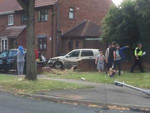 Supporting image for story: Two-car crash damages wall outside Tipton home 