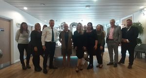 John (centre) with his colleagues at WMB Law