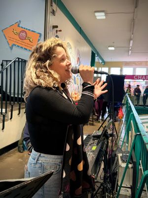 Market trader Libby Gliksman sings in aid of the Shrewsbury house fire appeal at Shrewsbury Market Hall