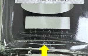 Real bottles will have this laser etched code.