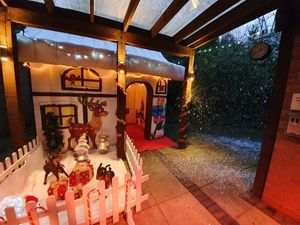 Supporting image for story: Inflatable grotto helps students meet Santa after school arson attack