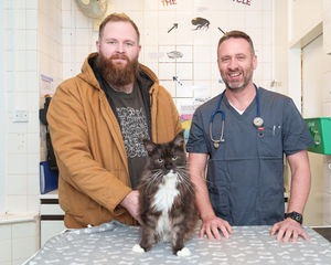 Batman with owner Genesis Rowley and vet Steve Calveley from Charter Vets.