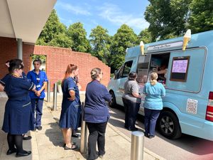 A queue of St Giles Hospice staff awaiting their free sweet treat.