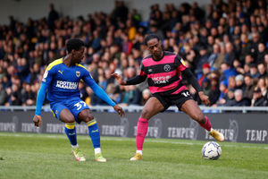 Nathanael Ogbeta of Shrewsbury Town and Paul Osew of AFC Wimbledon (AMA)