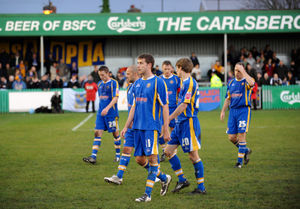 Dejected Shrewsbury Town players leave the field after losing 3-1 to Blyth Spartans