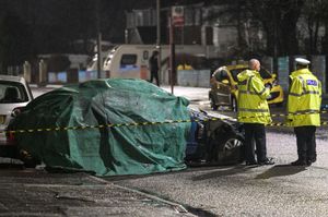 Police covered the car up after the crash. Photo: SnapperSK