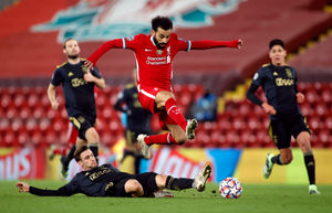 
              
Liverpool's Mohamed Salah jumps the tackle from Ajax   s Nicolas Tagliafico during the UEFA Champions League Group D match at Anfield, Liverpool. PA Photo. Picture date: Tuesday December 1, 2020. See PA story SOCCER Liverpool. Photo credit should read: Phil Noble/PA Wire. RESTRICTIONS: Editorial use only, no commercial use without prior consent from rights holder.
            

