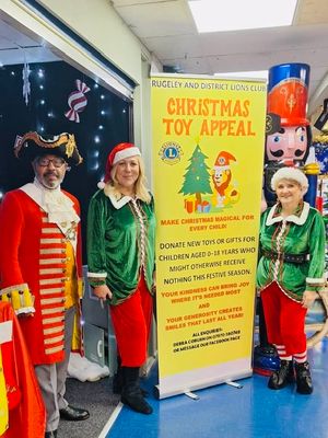 Lions President Debra Coburn with Lion Elaine Morgan and Town Crier Adrian Basford