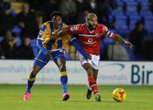 Jean-Louis Akpa Akpro of Shrewsbury Town and Adam Chambers of Walsall