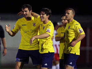 Andy Owens of AFC Telford United is congratulated by Sean Clancy and Tony Gray after scoring a goal to make it 0-1
