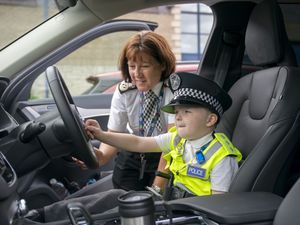 Supporting image for story: Boy, six, given special title after fundraising tour of 66 police stations