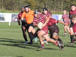 Newport Salop Rugby Club's Chris Taylor, pictured centre with the ball, helped save the life of a Rossendale coach. 